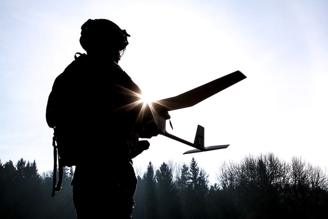 Army Spc. William Ritter prepares to launch an RQ-11 Raven, small unmanned aerial system, during Allied Spirit VIII at Hohenfels Training Area, Germany.