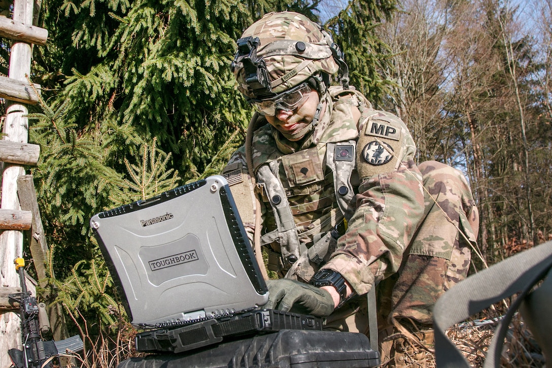 Army Spc. William Ritter runs software used to control the RQ-11 Raven, a small unmanned aerial system during Allied Spirit VIII at Hohenfels Training Area, Germany.