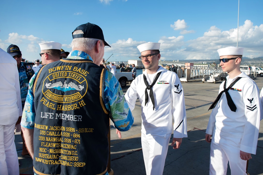Sailors are greeted by veterans during the change of home port of fast-attack submarine USS Missouri.