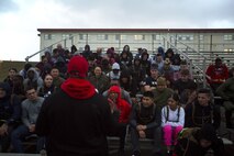 Gunnery Sgt. Jermarcus Tate, company gunnery sergeant for Headquarters Company, Combat Logistics Regiment 35, explains to Marines and Sailors of 3rd Marine Logistics Group the rules for the Kinser Challenge at Roberts Field on Camp Kinser, Okinawa, Japan Jan. 26, 2018. The Kinser Challenge is an event organized by the 3rd MLG chaplain’s office and hosted by Combat Logistics Regiment 35, to promote camaraderie, physical exercise, mental aptitude and spiritual wellness. (U.S. Marine Corps photo by Pfc. Jamin M. Powell)
