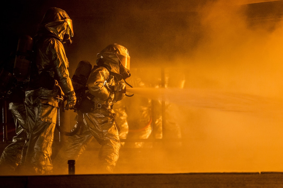 Aircraft Rescue and Firefighting Marines extinguish a jet fuel training aboard Marine Corps Air Station Beaufort, Jan 19. The Marines are with Headquarters and Headquarters Squadron.