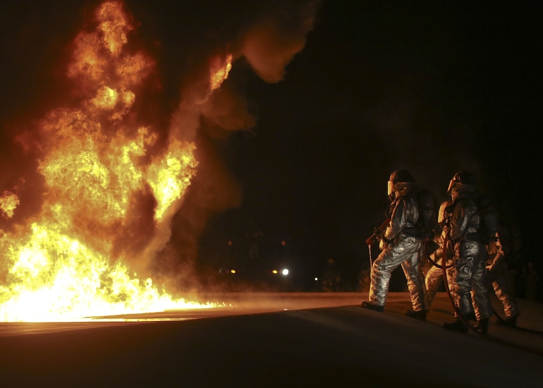 Aircraft Rescue and Firefighting Marines observe a jet fuel training fire aboard Marine Corps Air Station Beaufort, Jan. 19. The exercise was conducted to test ARFF's readiness for a potential aircraft mishap. The Marine is with Headquarters and Headquarters Squadron.