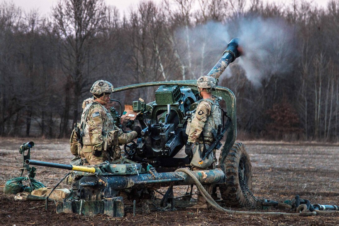 Soldiers fire an M119A3 howitzer during unit validation at Fort Campbell, Kentucky.