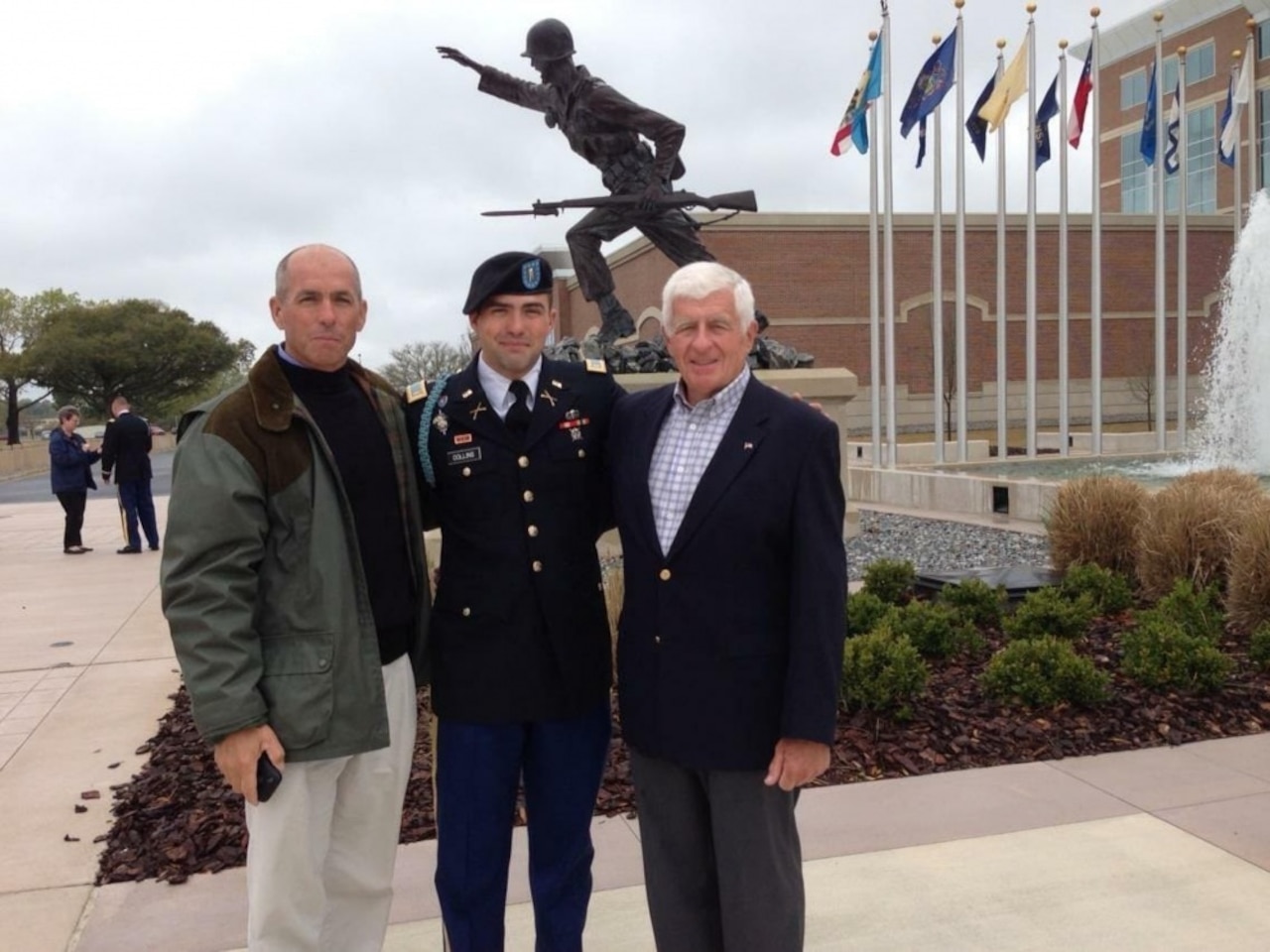 Retired Navy Seal Lt. Cmdr. James W. Collins, left, Army Capt. Christopher J. Collins, a combat advisor with the 1st Security Force Assistance Brigade, center, and retired Army Capt. James R. Collins, right, pose for a photo at the Maneuver Center of Excellence at Fort Benning, Ga., June 7, 2013, following Collins’ graduation. Collins and his grandfather, retired Capt. James R. Collins, both served as combat advisors. Army photo by Staff Sgt. Sierra A. Melendez