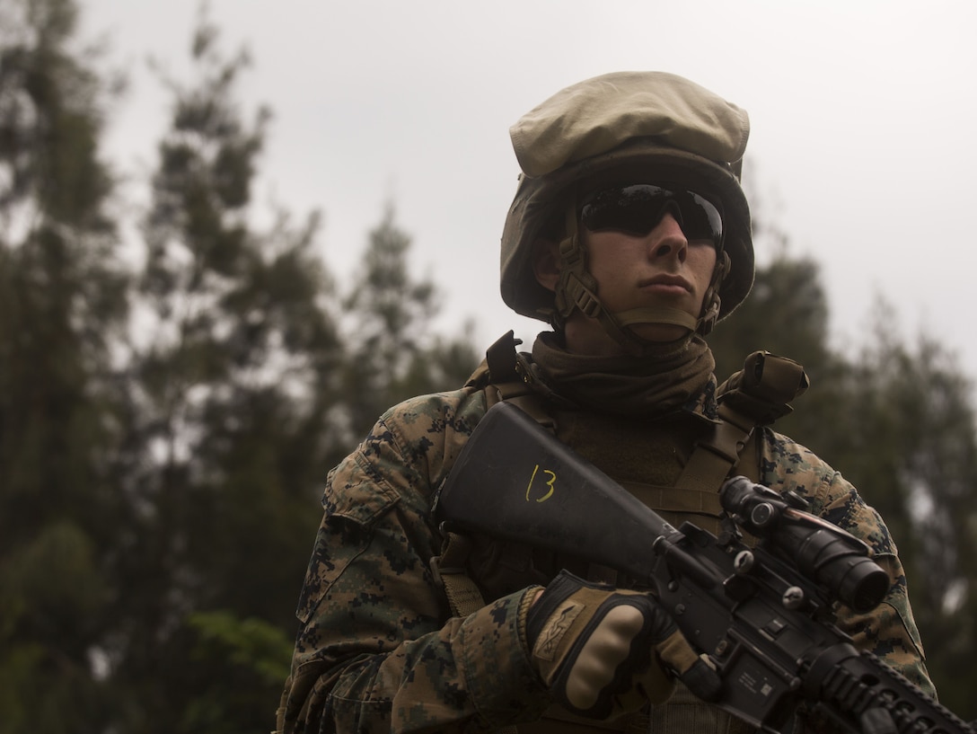 U.S. Marine Lance Cpl. Nathon Peterson provides security during Exercise Samurai Jan. 23, 2018, on Camp Hansen, Okinawa, Japan. Marines with Headquarters Battalion, 3rd Marine Division trained to refine their skills for Division operations in an expeditionary environment. Peterson, a native of Hamilton, Montana, supported the exercise as a rifleman in a provisional rifle platoon.