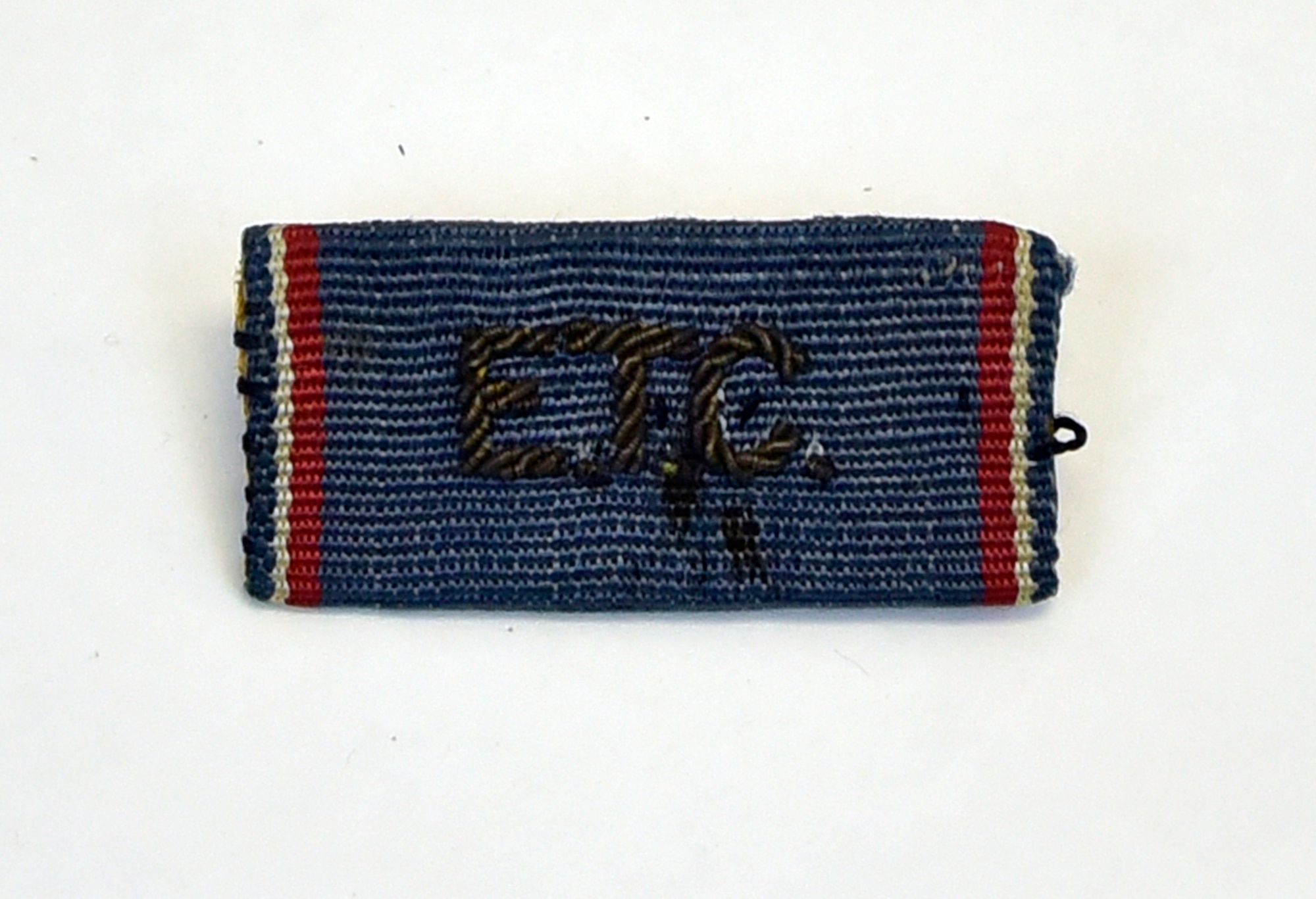Plans call for this artifact to be displayed near the B-17F Memphis Belle™ as part of the new strategic bombardment exhibit in the WWII Gallery, which opens to the public on May 17, 2018. Col Stanley Wray, 91st BG commander, wore this amusing “ETC” ribbon for King George VI and Queen Elizabeth’s review of the Memphis Belle.