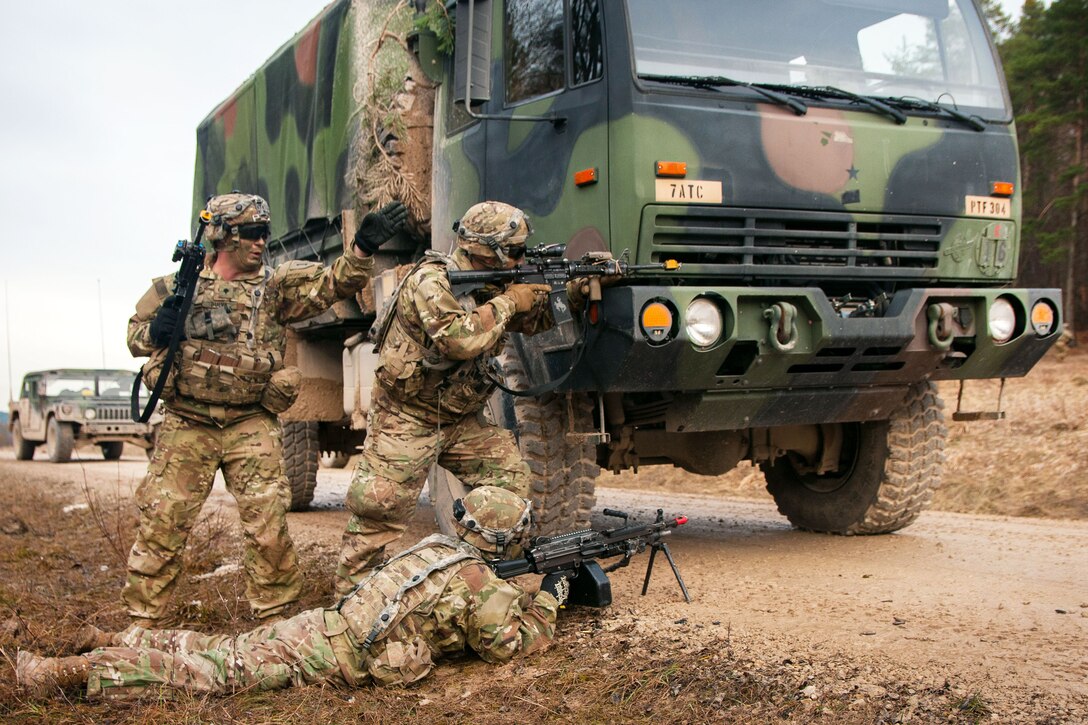 Soldiers react to opposing forces contact during exercise Allied Spirit VIII at Hohenfels Training Area, Germany.