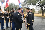 Maj. Gen. John F. King (left) takes the Task Force-51 colors from Lt. Gen. Jeffrey S. Buchanan, commander, U.S. Army North (Fifth Army), during a change of command ceremony at the historic quadrangle at Joint Base San Antonio-Fort Sam Houston Jan. 26. King assumes command of TF-51 from Maj. Gen. Brian C. Harris. TF-51 is Army North’s contingency command post and conducts a Defense Support of Civil Authority, homeland defense and theater security cooperation in order to promote the defense and security of the United States.