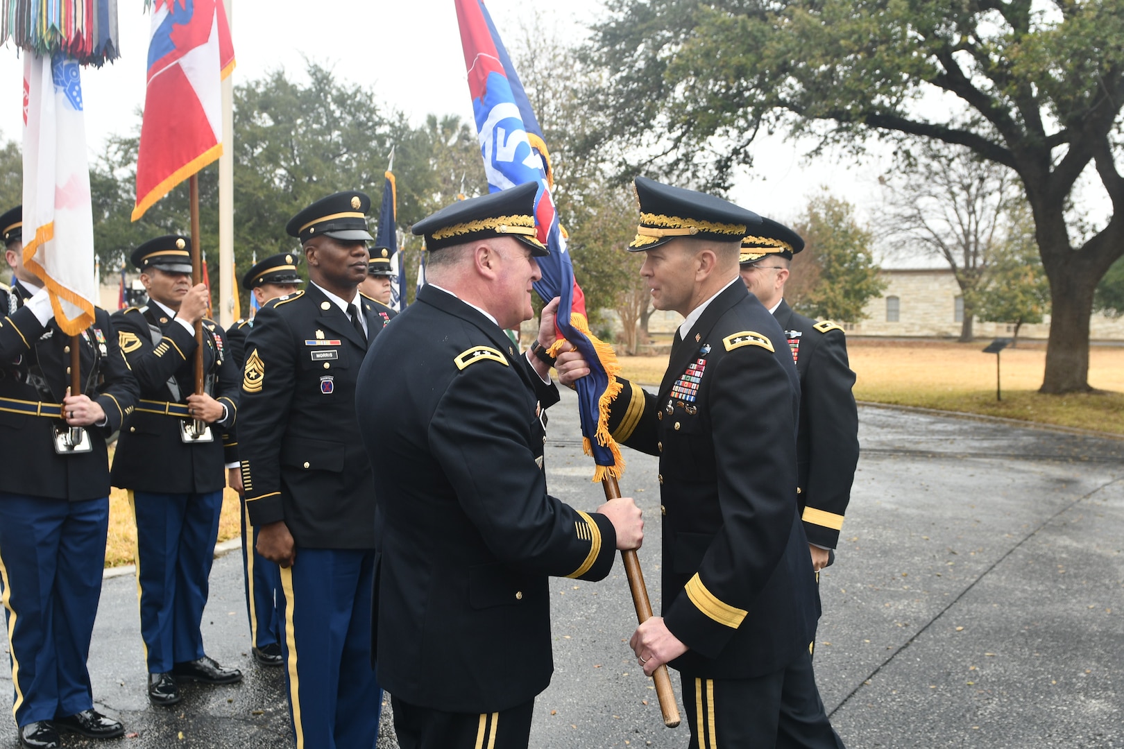 Maj. Gen. John F. King (left) takes the Task Force-51 colors from Lt. Gen. Jeffrey S. Buchanan, commander, U.S. Army North (Fifth Army), during a change of command ceremony at the historic quadrangle at Joint Base San Antonio-Fort Sam Houston Jan. 26. King assumes command of TF-51 from Maj. Gen. Brian C. Harris. TF-51 is Army North’s contingency command post and conducts a Defense Support of Civil Authority, homeland defense and theater security cooperation in order to promote the defense and security of the United States.