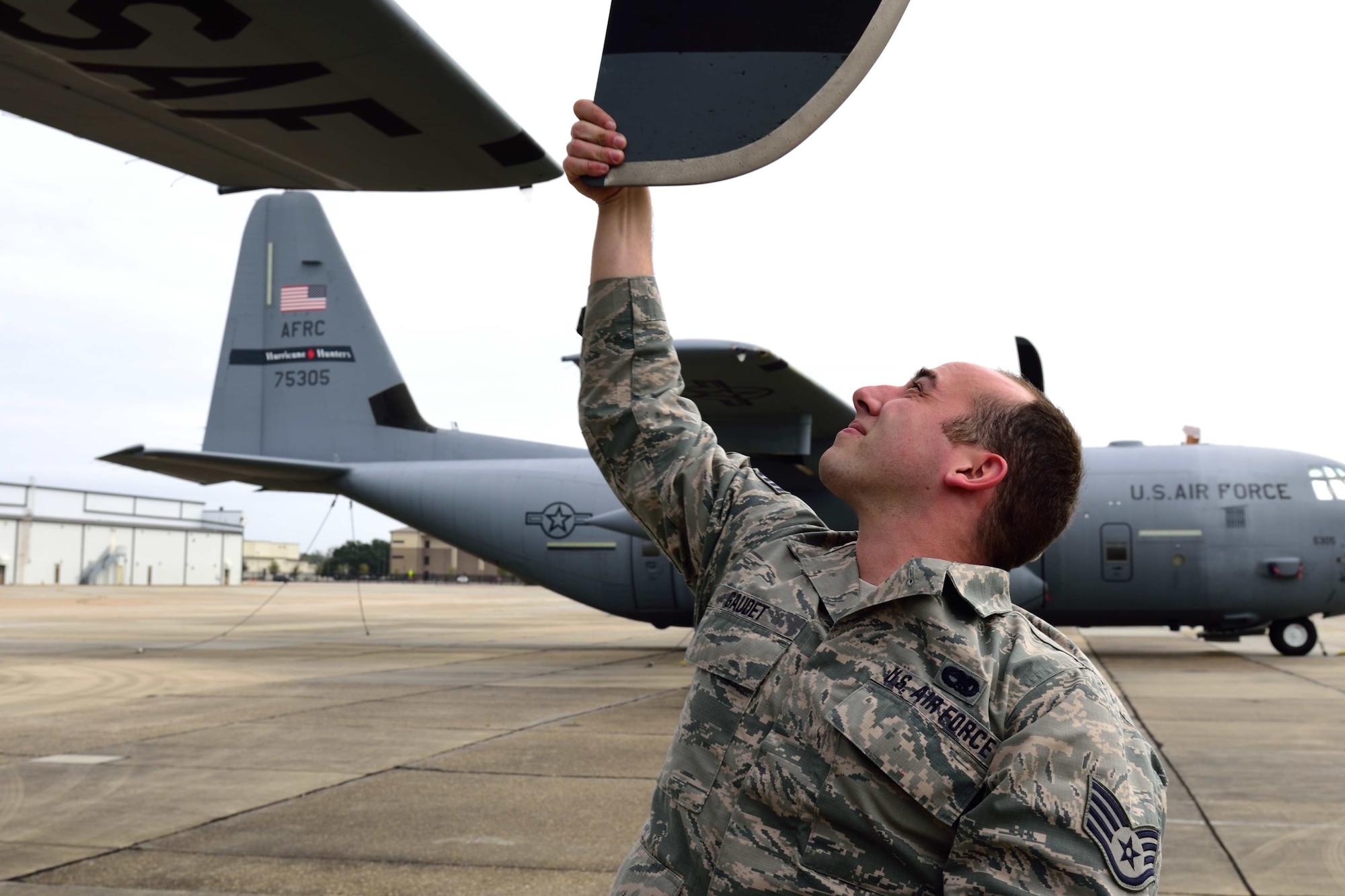 Staff Sgt. Patrick Gaudet, 403rd Aircraft Maintenance Squadron dedicated crew chief, inspects the propeller blade of a WC-130J Super Hercules aircraft to make sure there are no cracks or other damage Jan. 26, 2018, at Keesler Air Force Base, Mississippi. Crew chiefs are responsible for performing numerous checks, tests and maintenance on aircraft to make sure the Air Force fleet is fit for flight. (U.S. Air Force photo by Tech. Sgt. Ryan Labadens)