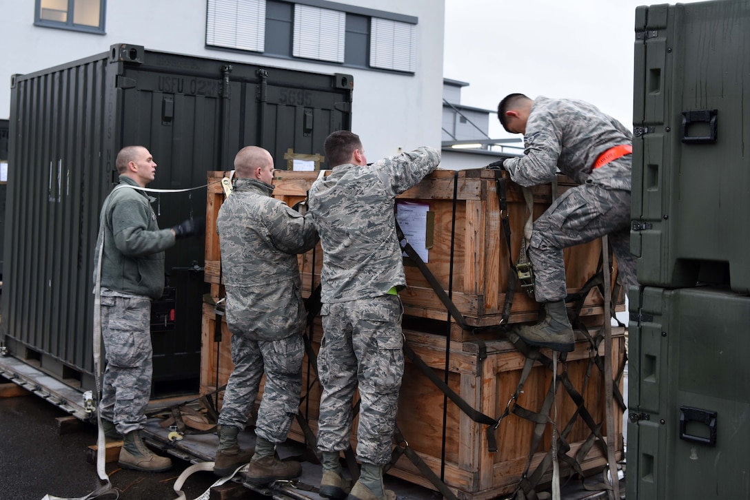 U.S. Airmen assigned to the 86th Logistics Readiness Group participate in a mobility exercise on Ramstein Air Base, Germany Jan. 26, 2018. The Airman practiced securing a pallet on a cargo plane.
