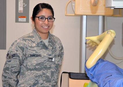 Air Force Airman 1st Class Gisella Panchana poses in the radiology laboratory at the Medical Education and Training Campus at Joint Base San Antonio-Fort Sam Houston. She is set to graduate from the METC radiology program Jan. 30 and will continue her training as a radiology technician at Travis Air Force Base, Calif.