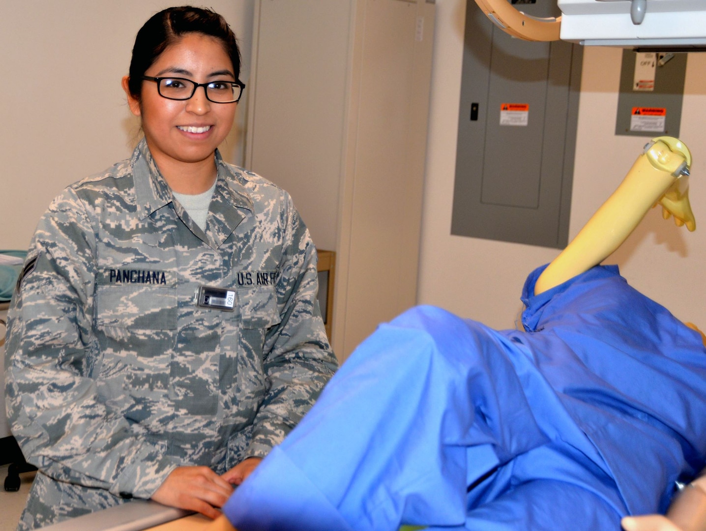 Air Force Airman 1st Class Gisella Panchana poses in the radiology laboratory at the Medical Education and Training Campus at Joint Base San Antonio-Fort Sam Houston. She is set to graduate from the METC radiology program Jan. 30 and will continue her training as a radiology technician at Travis Air Force Base, Calif.