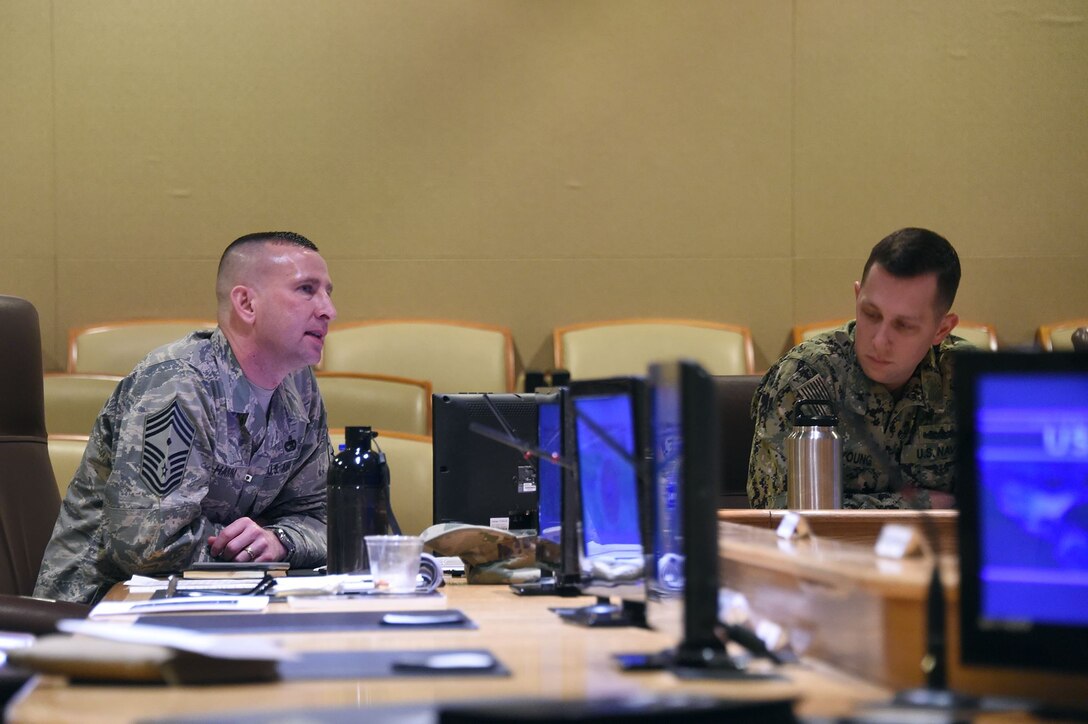 U.S. Air Force Chief Master Sgt. Johnny Hamm (left), U.S. Strategic Command (USSTRATCOM) first sergeant, delivers remarks during the inaugural non-commissioned officer (NCO) and petty officer (PO) joint professional development seminar at Offutt Air Force Base, Neb., Jan. 24, 2018. During the two-day course, NCOs and POs assigned to USSTRATCOM and the 55th Wing discussed leadership techniques with senior enlisted leaders and officers through a series of discussion panels and briefings. This pilot course was developed by USSTRATCOM’s senior enlisted leaders to enhance the effectiveness of soldiers, sailors, airmen and Marines at the E-5 and E-6 level through joint professional military education.