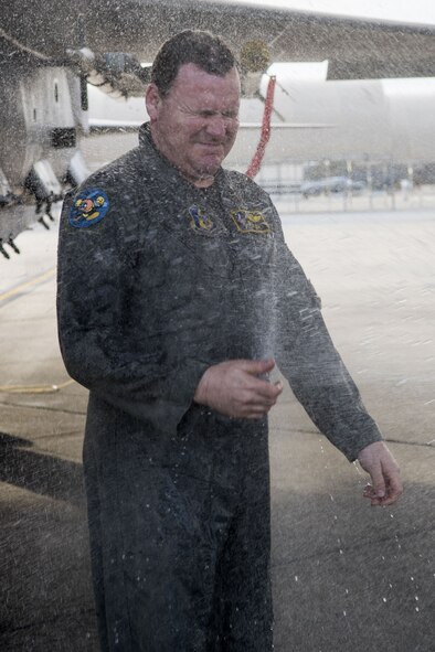 Lt. Col. Eric Ostendorf, 307th Fighter Squadron assistant director of operations, gets sprayed after exiting an F-15E Strike Eagle in celebration of his reaching his 3,000th flying hour in the jet, Jan. 26, 2018, at Seymour Johnson Air Force Base, North Carolina.