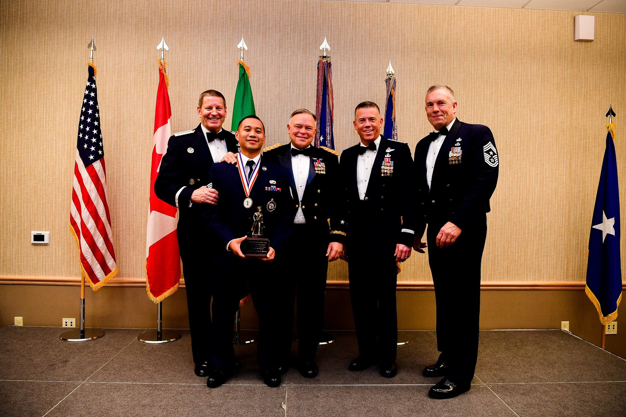 American Lake Conference Center on Joint Base Lewis-McChord, Washington, Jan. 27, 2018.  Rivera was awarded the trophy for his outstanding contributions to the Washington Air National Guard over the last year.  Pictured from left to right are: Gen. Robin Rand, Air Force Global Strike Command and Air Forces Strategic-Air, U.S. Strategic Command commander, Rivera, Maj. Gen. Bret Daugherty, Adjutant General of the Washington National Guard, Montgomery, Brig. Gen. Jeremy Horn, commander of the Washington Air National Guard, River, and Chief Master Sgt. Max Tidwell, Washington Air National Guard command chief. (U.S. Air National Guard photo by Tech. Sgt. Timothy Chacon)