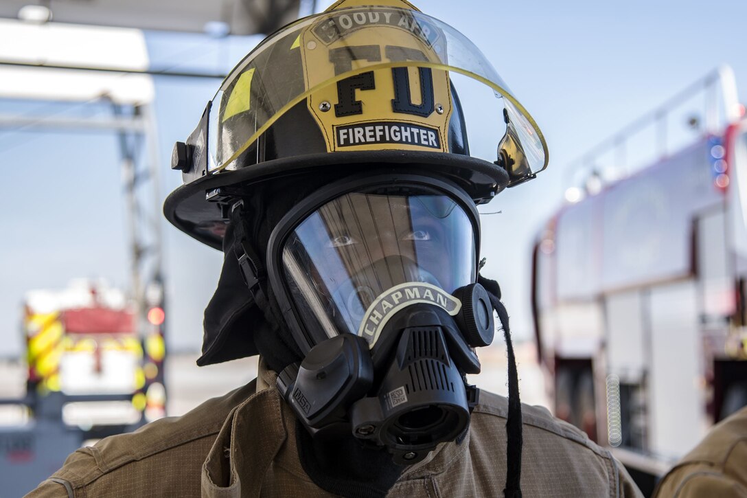 Airman 1st Class Orlando Chapman, 23d Civil Engineer Squadron (CES) firefighter looks up at an A-10C Thunderbolt II during extraction training, Jan. 25, 2018, at Moody Air Force Base, Ga. Firefighters from the 23d CES conducted A-10C Thunderbolt II extraction training to practice extinguishing an aircraft fire and quickly rescuing a pilot from an A-10. The 23d CES holds the extraction training twice annually and are evaluated on the amount of time it takes them to rescue a pilot from the cockpit. (U.S. Air Force photo by Airman Eugene Oliver)