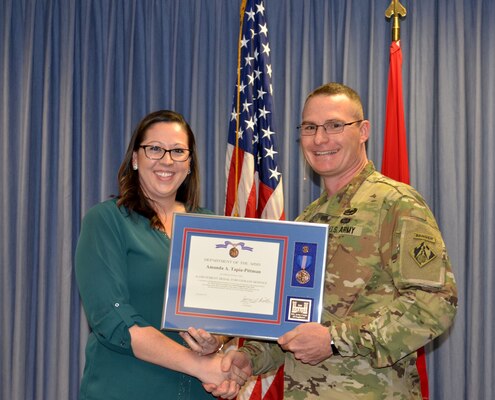 ALBUQUERQUE, N.M. – District commander Lt. Col. James Booth recognizes Amanda Tapia-Pittman as the District’s Employee of the Year during the District’s 2017 Annual Award Presentations, Dec. 8, 2017.