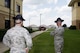 Officer Training School Military Training Instructors watch as the newest OTS students arrive on campus, June 28, 2017, at Maxwell Air Force Base, Ala. During the first day of training the students are sorted into their flights and taught basic military drill movement, from there they proceed to in-processing. (U.S. Air Force photo by Senior Airman Alexa Culbert)