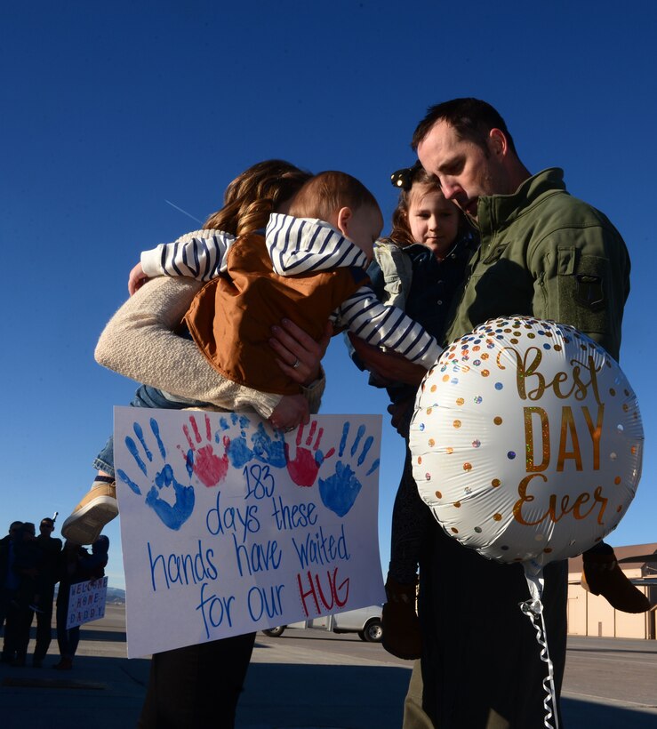 Capt. Lance, a weapons system officer assigned to the 37th Bomb Squadron, is reunited with his wife, Ashley, and their children, Oakley and Tatum, at Ellsworth Air Force Base, S.D., following a six-month deployment to Andersen AFB, Guam, Jan. 24, 2018. B-1 bomber aircrews conducted sorties close to South Korea’s northern border as part of the U.S. Pacific Command’s Continuous Bomber Presence mission. (U.S. Air Force photo by Airman 1st Class Donald Knechtel)