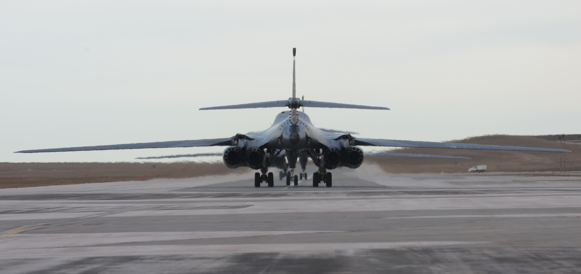 B-1 bombers returning from Andersen Air Force Base, Guam, taxi down the runway at Ellsworth Air Force Base, S.D., Jan. 25, 2018. B-1 bombers from the 37th Bomb Squadron and Airmen from the 37th Aircraft Maintenance Unit were deployed to Andersen AFB, to take part in the Continuous Bomber Presence mission. (U.S. Air Force photo by Airman 1st Class Nicolas Z. Erwin)