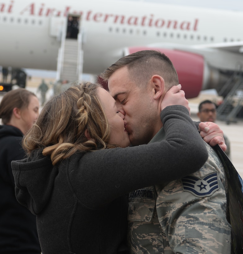 Staff Sgt. Gabriel Henry, a crew chief assigned to the 28th Aircraft Maintenance Squadron, is greeted on the flight line at Ellsworth Air Force Base, S.D., Jan. 29, 2018, after returning from a six-month deployment to Andersen AFB, Guam. B-1 bombers from the 37th Bomb Squadron and Airmen from the 37th Aircraft Maintenance Unit were deployed to Anderson AFB to take part in the Continuous Bomber Presence mission. (U.S. Air Force photo by Airman 1st Class Thomas Karol)