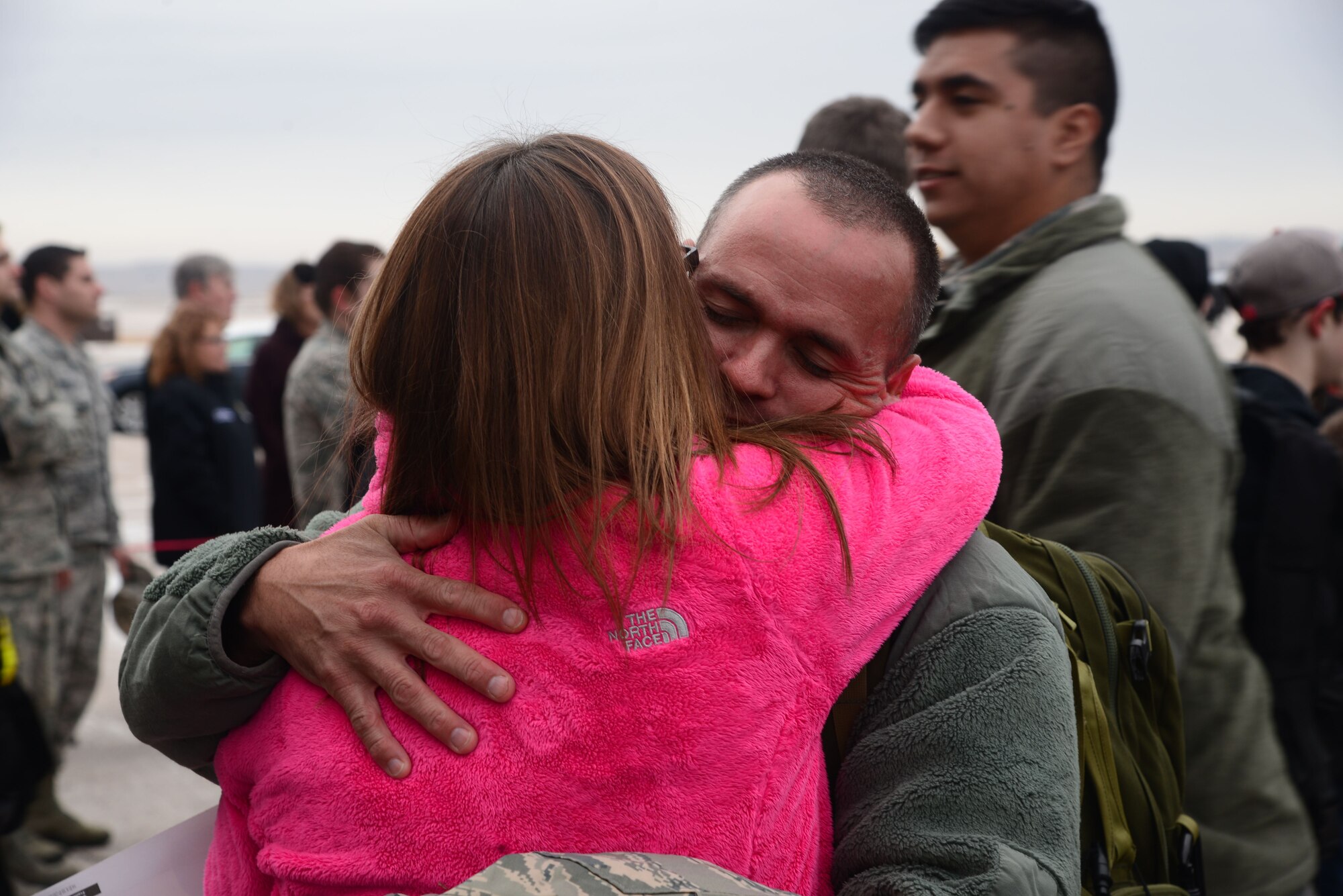 Senior Master Sgt. Derek Hulsey, the 28th Aircraft Maintenance Squadron first sergeant, hugs his wife, Master Sgt. Deborah Hulsey, the 28th Medical Operations Squadron superintendent, at Ellsworth Air Force Base, S.D., Jan. 29, 2018. B-1 Bombers from the 37th Bomb Squadron and Airmen from the 37th Aircraft Maintenance Unit returned from a six-month deployment to Andersen AFB, Guam, where they took part in the Continuous Bomber Presence mission. (U.S. Air Force photo by Airman 1st Class Donald Knechtel)