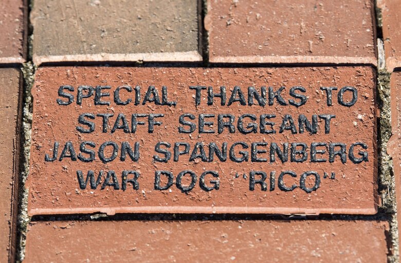 A brick with a thank you message lies at the base of the War Dog Memorial in the Kent County Veterans Memorial Park, Dover, Del., Jan. 25, 2018. The War Dog Memorial features a picture engraved in granite of then-Staff. Sgt. Jason Spangenberg, 436th Security Forces Squadron, and Military Working Dog Rico. (U.S. Air Force photo by Roland Balik)