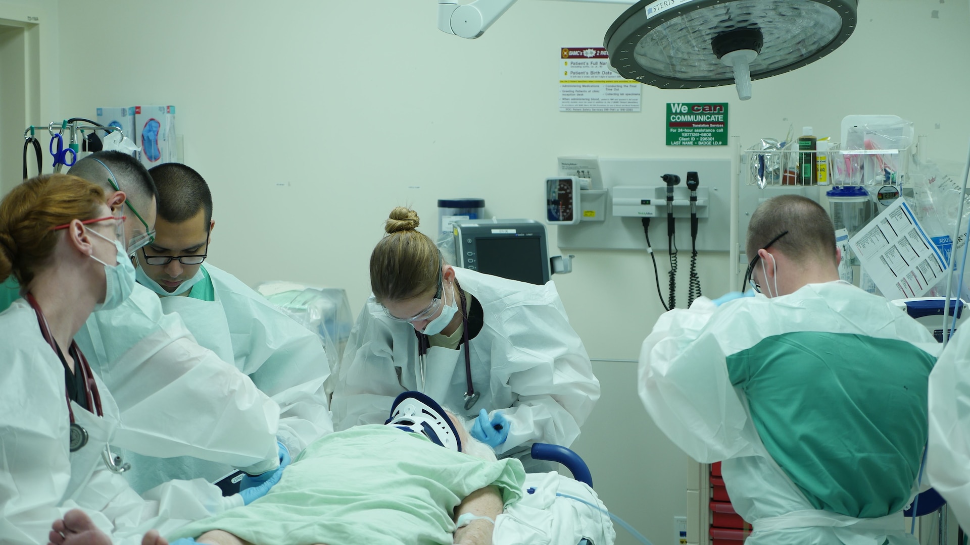 A trauma team examines a patient in the emergency department at Brooke Army Medical Center. BAMC has again been verified as a Level I trauma center by the American College of Surgeons.