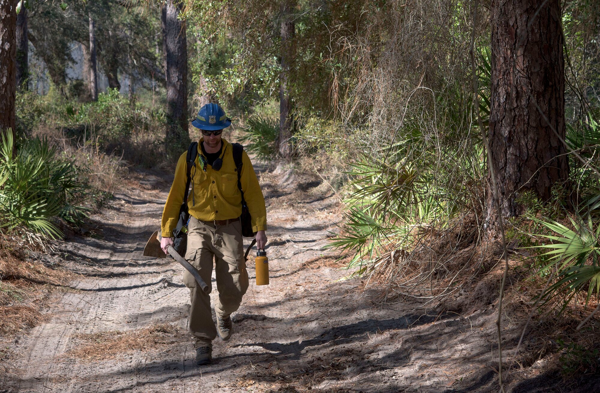 Air Force Civil Engineer Center wildland fire managers conduct a prescribed burn at White Point Recreation Area on the Eglin reservation in Florida. Prescribed fires maintain the base's ecosystem in its pristine state, reduce dangerous buildup of understory and enable maximum flexibility to conduct test and training missions without causing catastrophic wildfires.The Fire Management division here applies prescribed fire to an average of 90,000 acres annually.