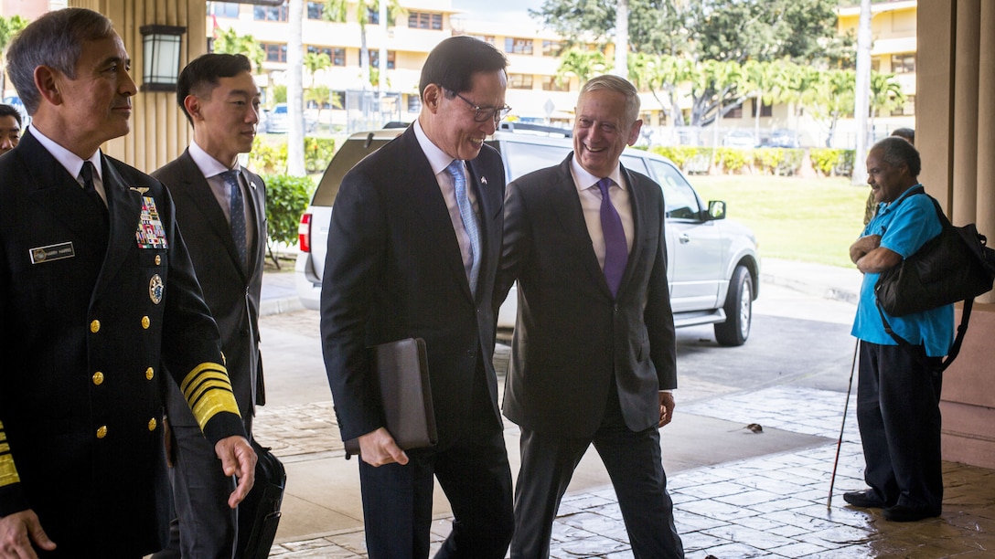 U.S. and South Korean defense leaders walk together before a meeting in Hawaii.