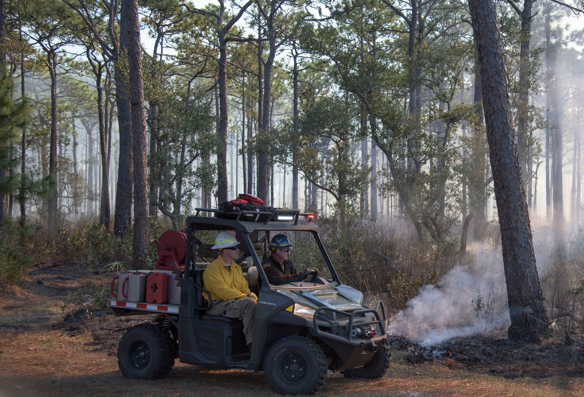Air Force Civil Engineer Center wildland fire managers conduct a prescribed burn at White Point Recreation Area on the Eglin reservation in Florida. Prescribed fires maintain the base's ecosystem in its pristine state, reduce dangerous buildup of understory and enable maximum flexibility to conduct test and training missions without causing catastrophic wildfires.The Fire Management division here applies prescribed fire to an average of 90,000 acres annually.