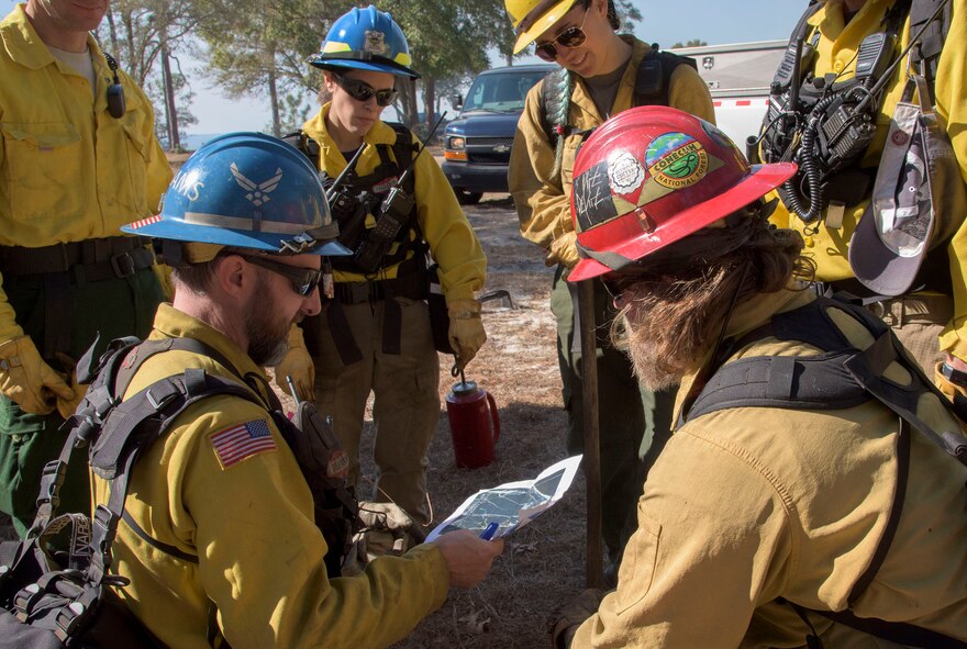 Air Force Civil Engineer Center wildland fire managers conduct a prescribed burn at White Point Recreation Area on the Eglin reservation in Florida. Prescribed fires maintain the base's ecosystem in its pristine state, reduce dangerous buildup of understory and enable maximum flexibility to conduct test and training missions without causing catastrophic wildfires.The Fire Management division here applies prescribed fire to an average of 90,000 acres annually.