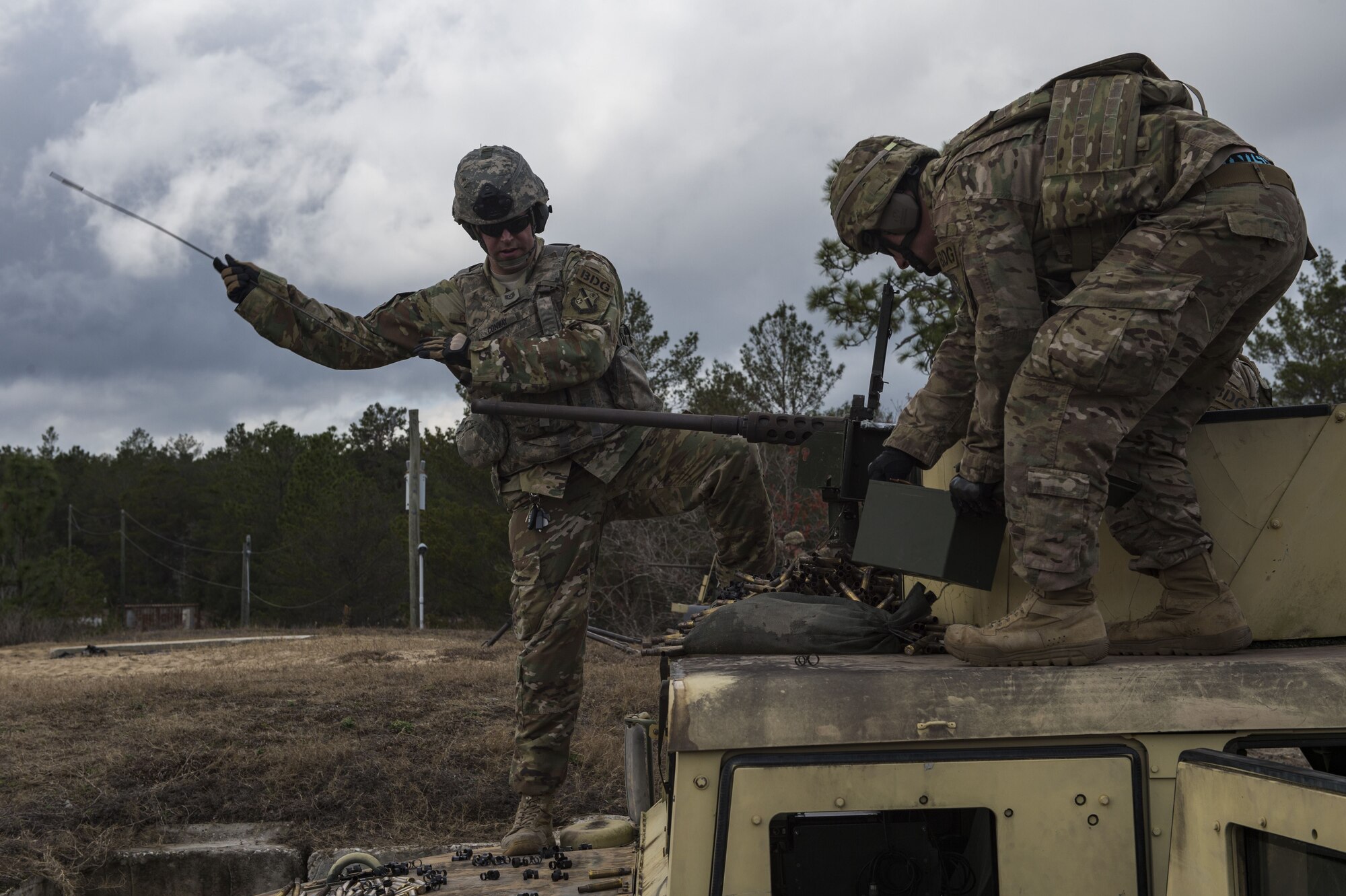 Airmen from the 824th Base Defense Squadron ensure a M2 machine gun is clear during Weapons Week, Jan. 23, 2018, at Camp Blanding Joint Training Center, Fla. During Weapons Week, Airmen qualify on heavy weapons to include the M2 machine gun, Mark 19 40mm grenade machine gun, M240B machine gun, M249 light machine gun, M136E1 AT4-CS confined space light anti-armor weapon, and M18 Claymore mine. (U.S. Air Force photo by Senior Airman Janiqua P. Robinson)