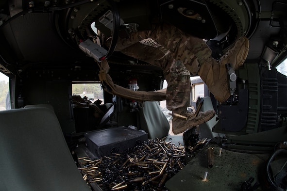 An Airman from the 824th Base Defense Squadron steadies himself while firing a M2 machine gun during Weapons Week, Jan. 23, 2018, at Camp Blanding Joint Training Center, Fla. During Weapons Week, Airmen qualify on heavy weapons to include the M2 machine gun, Mark 19 40mm grenade machine gun, M240B machine gun, M249 light machine gun, M136E1 AT4-CS confined space light anti-armor weapon, and M18 Claymore mine. (U.S. Air Force photo by Senior Airman Janiqua P. Robinson)