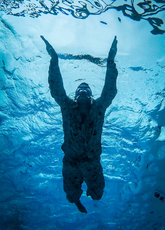A U.S. Marine Corps infantryman with Detachment 4th Force Reconnaissance Company conducts a 1km swim during a pool training event, Marine Corps Base Hawaii, Jan. 22, 2018. The event consisted of various exercises, including a 25 meter underwater swim, static breath holds, treading exercises, and gear retrievals. The unit’s training program aims to prepare students for the stresses of the BRC by offering a broad, realistic curriculum, challenging them both mentally and physically. (U.S. Marine Corps photo by Lance Cpl. Luke Kuennen)
