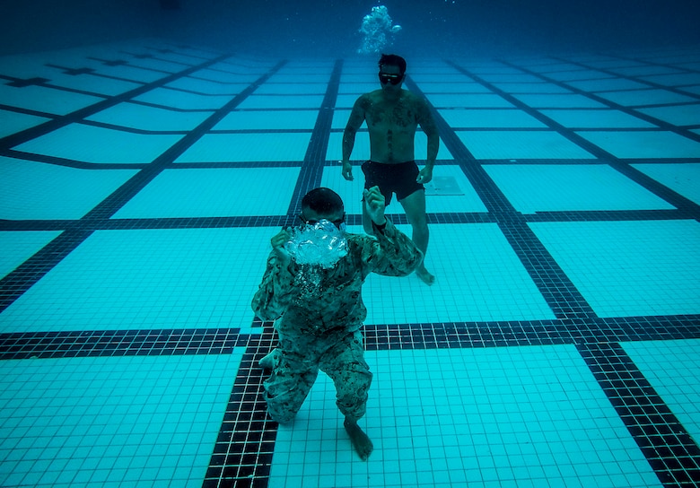 U.S. Marine Corps Pfc. Michael Garziano, an infantryman with Detachment 4th Force Reconnaissance Company, touches the bottom of the pool as part of a water treading exercise during a training event, Marine Corps Base Hawaii, Jan. 22, 2018. The event consisted of various exercises, including a 25 meter underwater swim, static breath holds, a 1km swim, and gear retrievals. The unit’s training program aims to prepare students for the stresses of the BRC by offering a broad, realistic curriculum, challenging them both mentally and physically. (U.S. Marine Corps photo by Lance Cpl. Luke Kuennen)