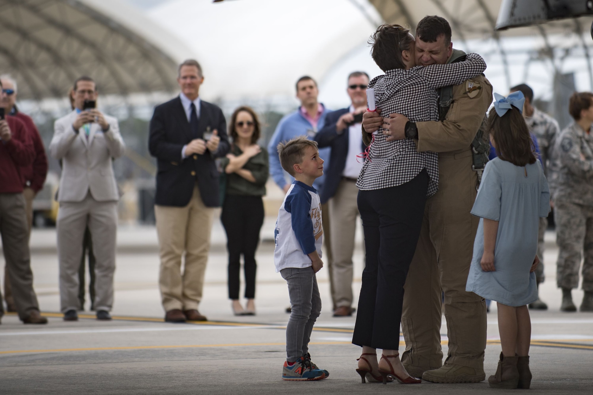 Lt. Col. Craig Morash, 74th Fighter Squadron commander, greets his family after returning from a deployment, Jan. 26, 2018, at Moody Air Force Base, Ga. During the seven-month deployment, the 74th FS flew more than 1,700 sorties, employed weapons more than 4,400 times, destroyed 2,300 targets and killed 2,800 ISIS insurgents. (U.S. Air Force photo by Senior Airman Daniel Snider)