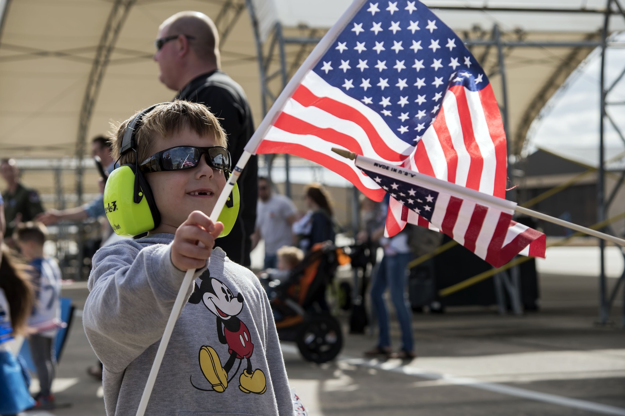 A child waves a flag during a redeployment of the 74th Fighter Squadron (FS) Jan. 26, 2018, at Moody Air Force Base, Ga. During the seven-month deployment the 74th FS flew more than 1,700 sorties, employed weapons more than 4,400 times, destroyed 2,300 targets and killed 2,800 insurgents. (U.S. Air Force photo by Airman Eugene Oliver)