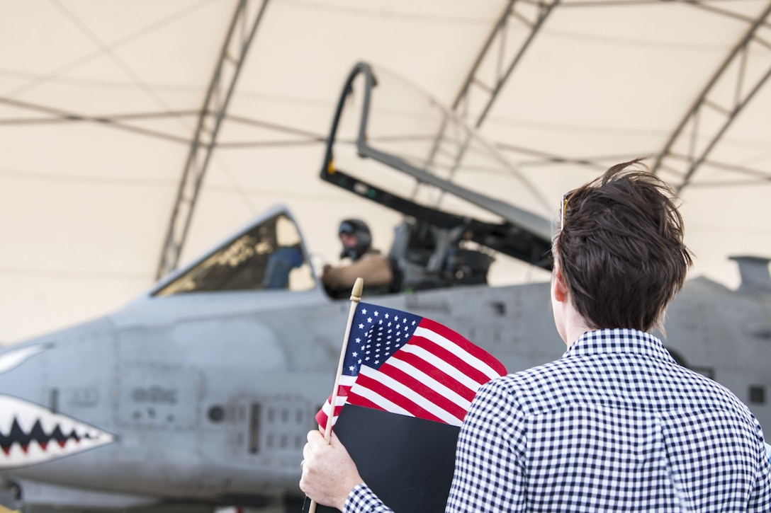 Jennifer, spouse of Lt. Col Craig Morash, 74th Fighter Squadron (FS) commander, waits to greet her husband as he returns from a deployment, Jan. 26, 2018, at Moody Air Force, Ga. During the seven-month deployment the 74th FS flew more than 1,700 sorties, employed weapons more than 4,400 times, destroyed 2,300 targets and killed 2,800 insurgents. (U.S. Air Force photo by Airman Eugene Oliver)