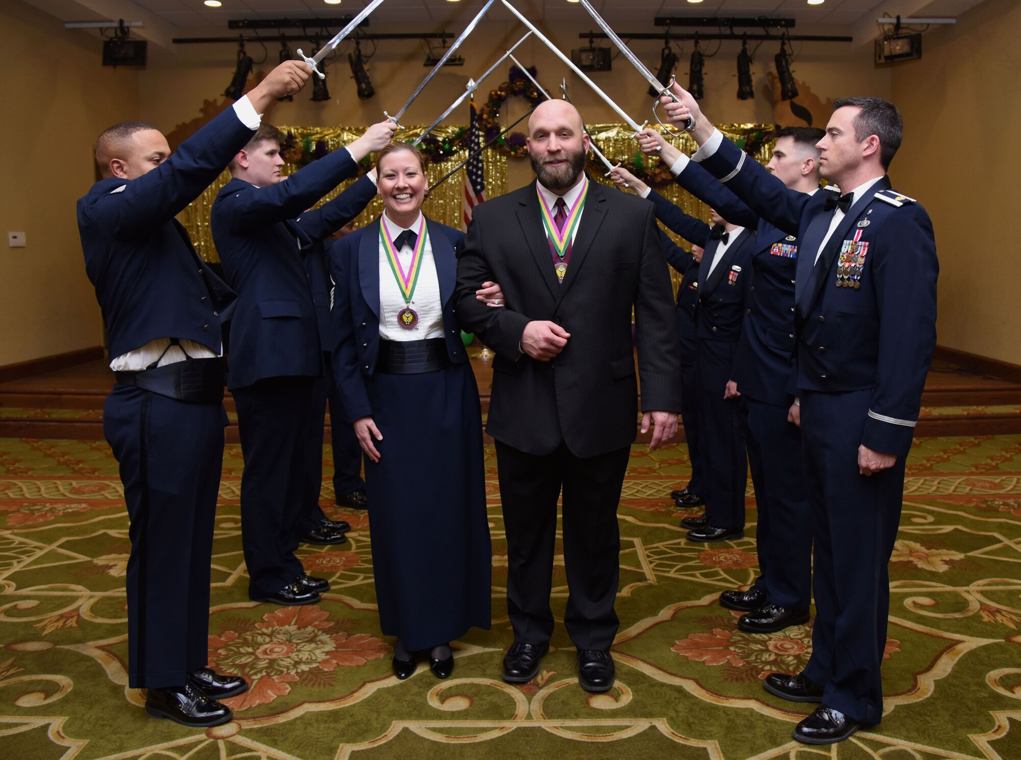 Master Sgt. Joleen Giddens, 81st Diagnostic and Therapeutics Squadron nutritional medicine flight chief, and Seth Giddens, 81st Security Forces Squadron antiterrorism program manager, pose for a photo during the 2017 Keesler Annual Awards Ceremony at the Bay Breeze Event Center Jan. 25, 2018, on Keesler Air Force Base, Mississippi. During the ceremony base leadership recognized outstanding Airmen and civilians from across the installation for their accomplishments throughout 2017. (U.S. Air Force photo by Kemberly Groue)