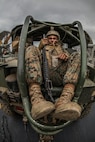 Private First Class Joshua Webb, with Alpha Battery,11th Marines, sits in the back seat of a M1163 Prime Mover as they load onto a Landing Craft Air Cushion as part of Iron Fist 2018, Jan. 19.