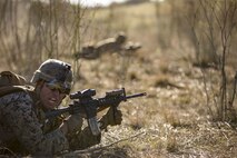 Pfc. Jose Martinez, an infantrymen with, Alpha Company, 1st Battalion, 4th Marines, 1st Marine Division aims down the sights as part of live fire training during exercise Iron Fist 2018, Jan. 17
