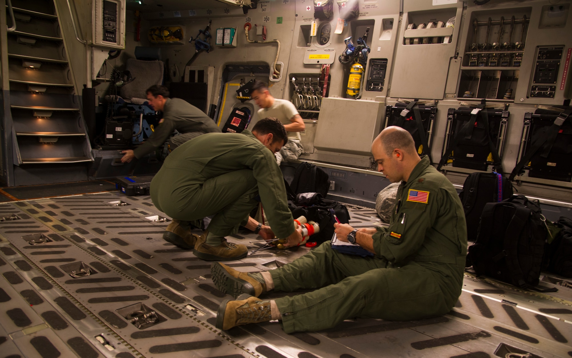Members of the 535th Airlift Squadron prepare equipment for an airdrop mission at Joint Base Pearl Harbor-Hickam, Hawaii, Jan. 25, 2018. Airdrop missions are part of the routine training for aircrew and logistics personnel. (U.S. Air Force photo by Tech. Sgt. Heather Redman)