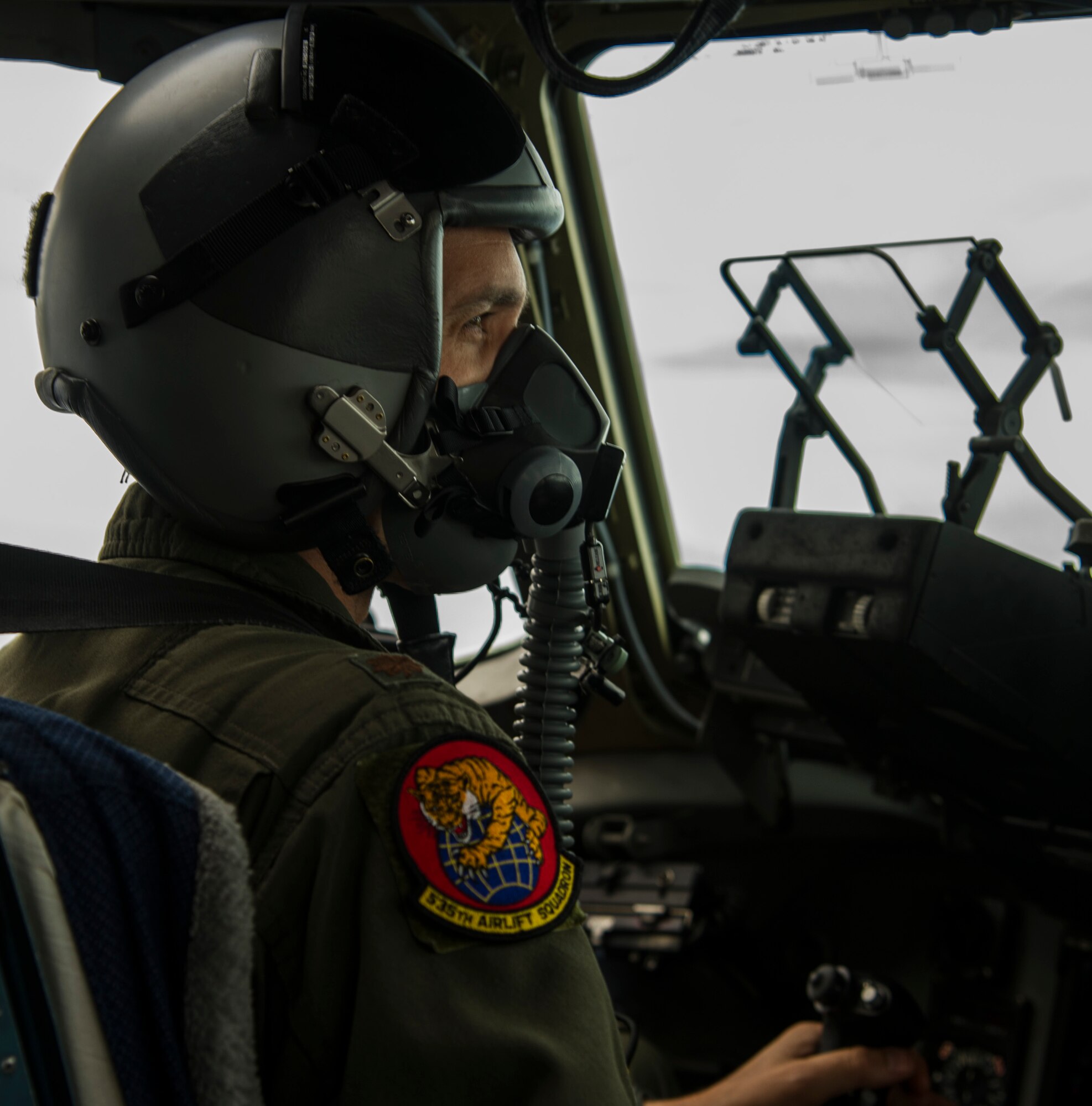 Maj. Shane Weeks, 535th Airlift Squadron pilot, flies a C-17 Globemaster III during an airdrop mission over Big Island, Hawaii, Jan. 25, 2018. Airdrop missions are part of the routine training for aircrew and logistics personnel. (U.S. Air Force photo by Tech. Sgt. Heather Redman)