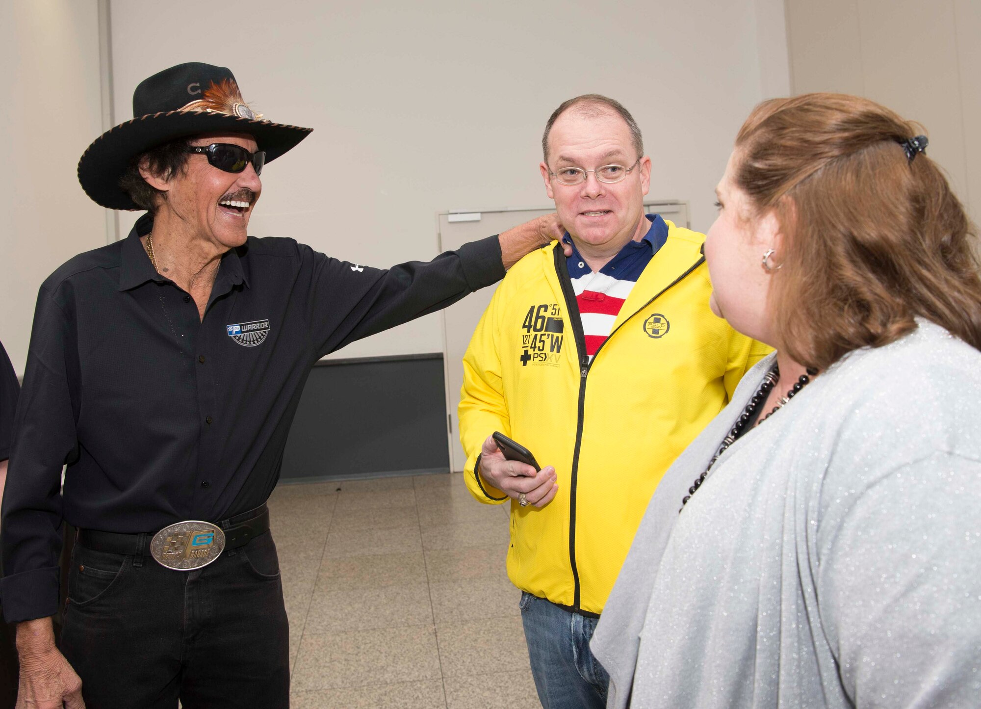 Richard Petty, left, Nascar legend, meets Brig. Gen. Richard G. Moore Jr., middle, 86th Airlift Wing commander, and Moore’s spouse, Kristin, on Ramstein Air Base, Germany, Jan. 27, 2018. The 86th Force Support Squadron, United States Air Force Recruiting Europe, the Kaiserslautern Military Community Center, and Military Auto Source brought Petty to Ramstein to participate in Air Force recruiting and help raise money for Paralyzed Vererans of America. (U.S. Air Force photo by Senior Airman Elizabeth Baker)