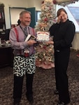 People and Culture winner, Jim, poses with the Commander as he receives his award for the ugliest sweater.