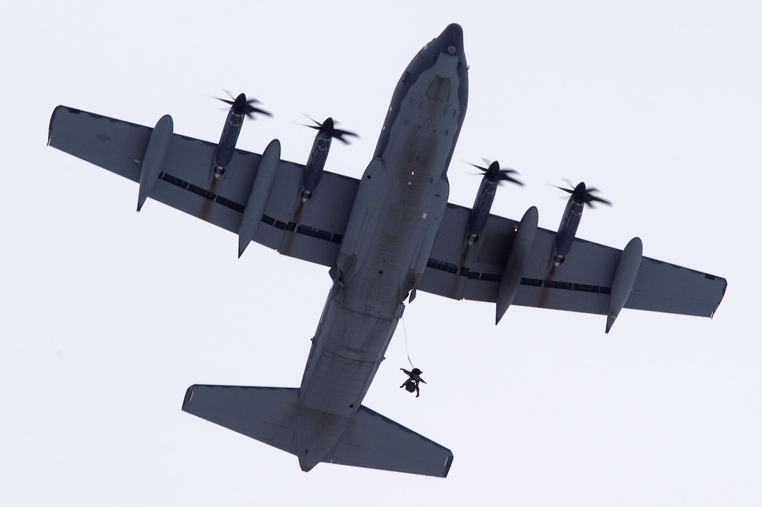 An Alaska Air National Guardsman jumps from a HC-130J Combat King II aircraft.