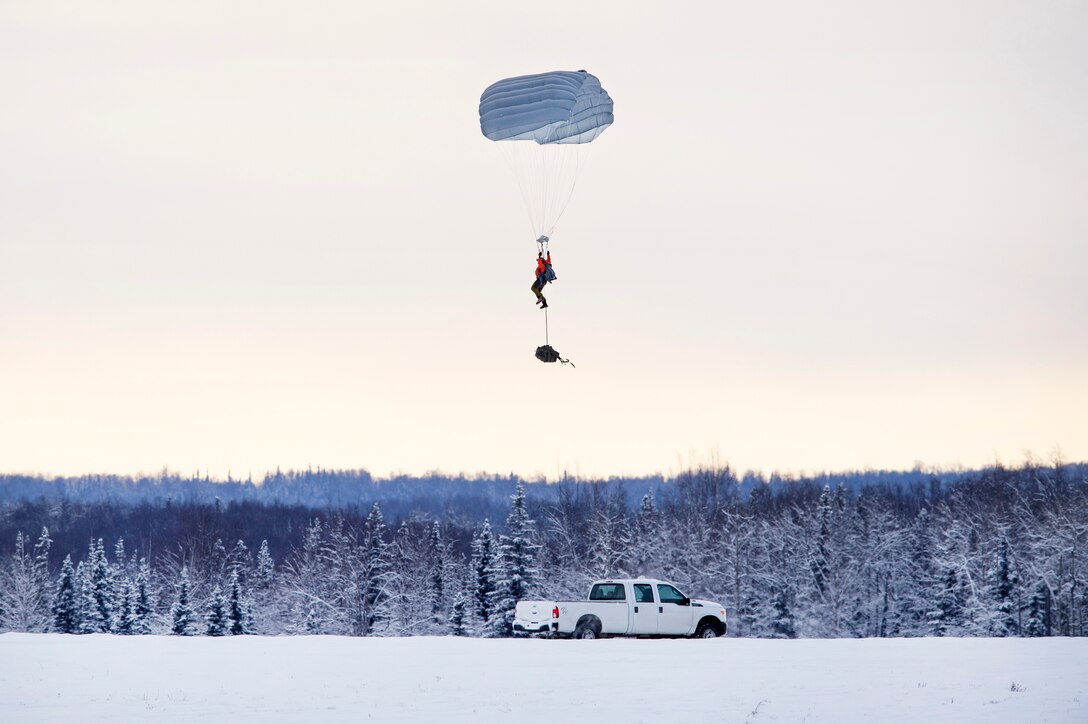 An Alaska Air National Guardsman approaches the landing zone.