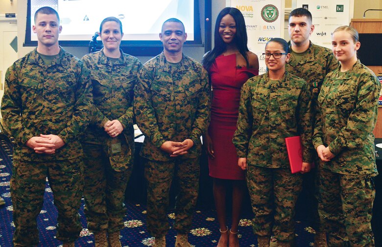 Marines join Miss USA 2016 and Army Reserve Capt. Deshauna Barber for a photograph after her keynote speech at the Prince William County Chamber of Commerce Veterans Council Salute to the Armed Forces lunch at The Clubs at Quantico.